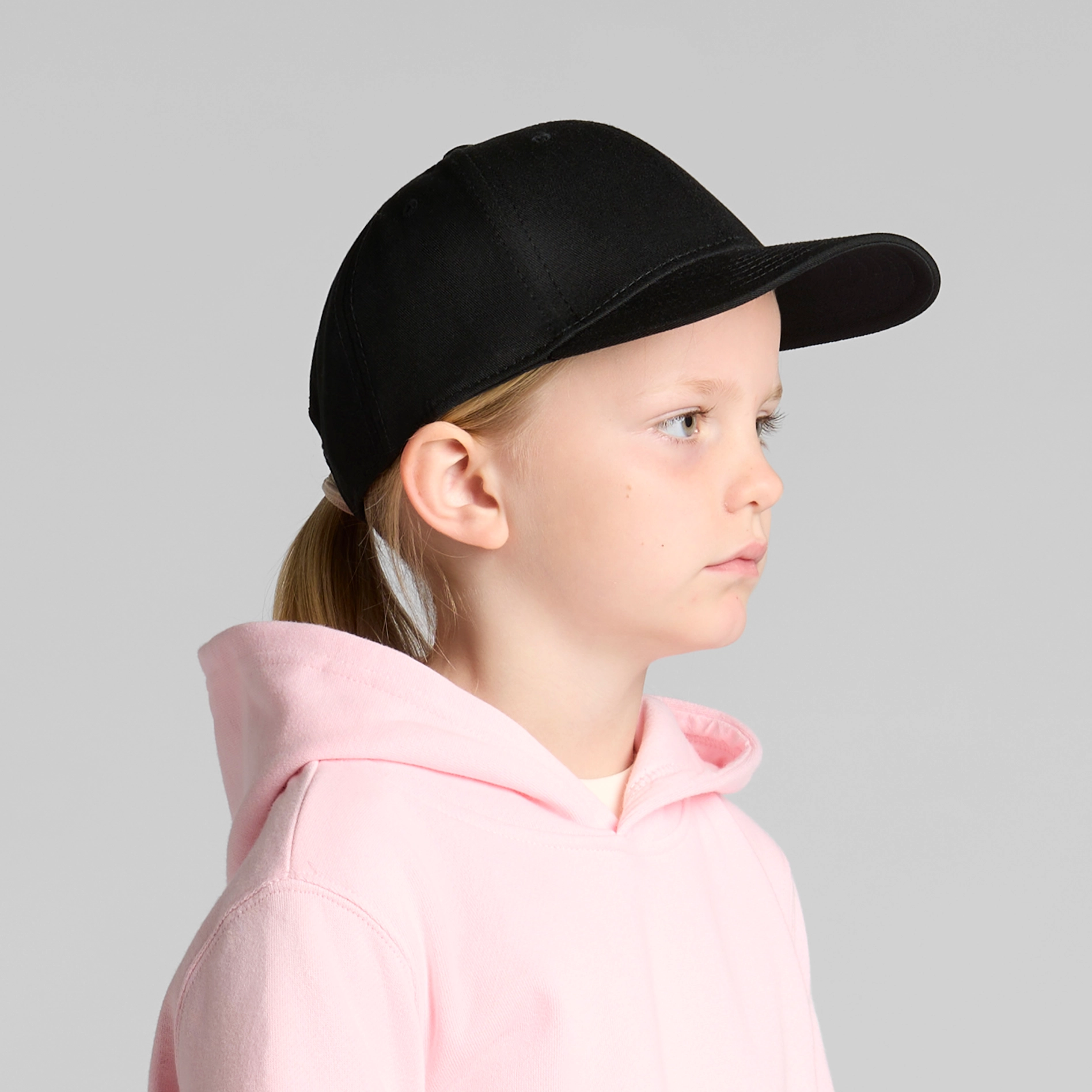 Girl wears black cap for printing