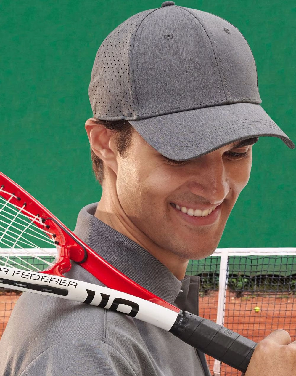 Laser Cut Runners Cap Man wearing grey cap with a tennis racket