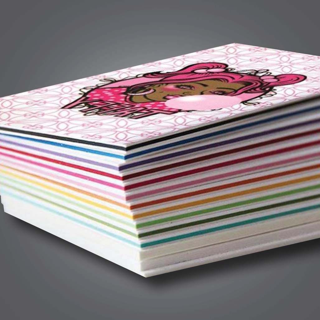 Multicoloured stack of stax business cards with the top card displaying a girl blowing a bubble with the text taffy