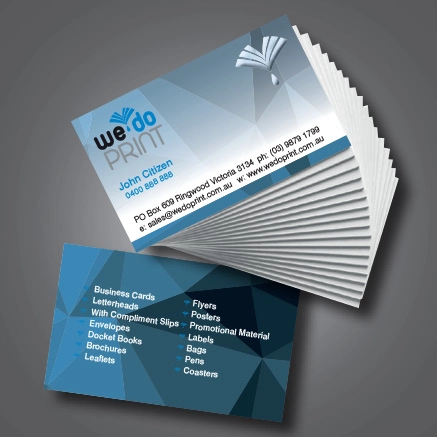 Stack of blue and white standard business cards displaying information about We Do Print